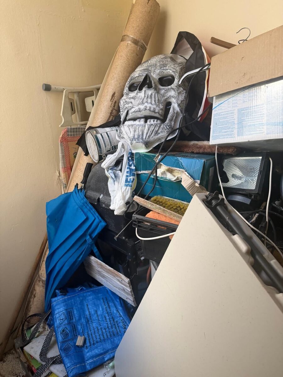 Before photo of a cluttered room needing professional clearance